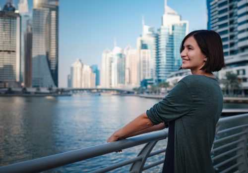 happy-young-female-traveler-in-the-big-city-of-dub-2026-03-26-05-44-49-utc